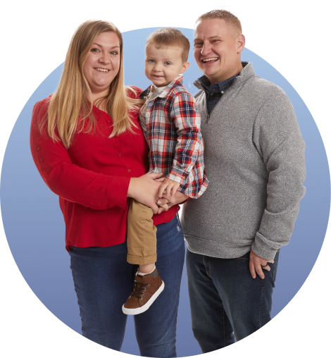 Krystal holding her son Dallas and standing next to her husband